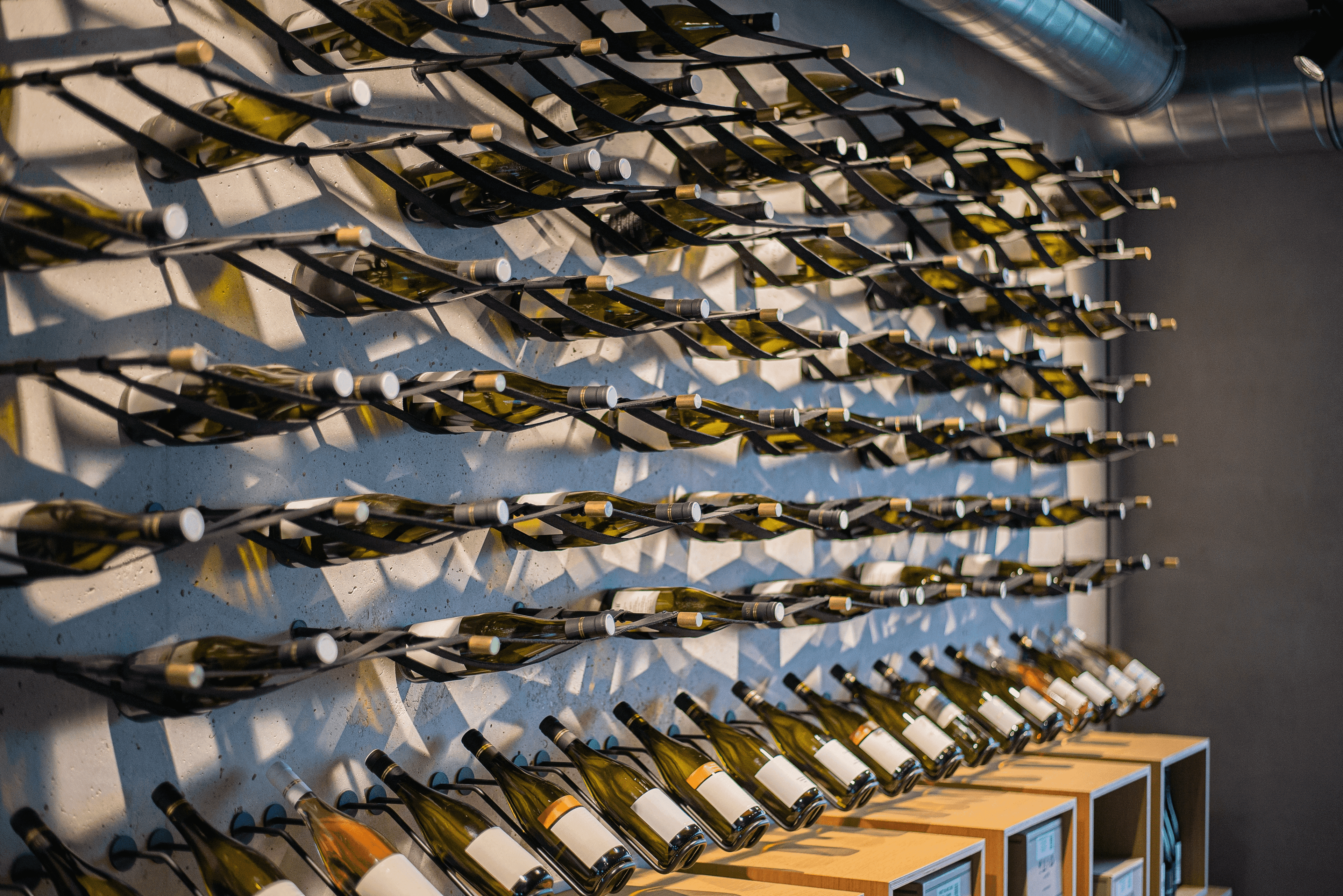 Picture of a wall rack full of wine bottles